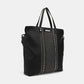 Nicole Lee USA Studded Large Tote Bag in black vegan leather with dual top handles, zipper detailing, and optional shoulder strap for convenient carrying.