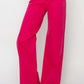 Bright pink high rise wide leg jeans by Risen Jeans, perfect for a trendy retro-inspired look and a flattering fit.