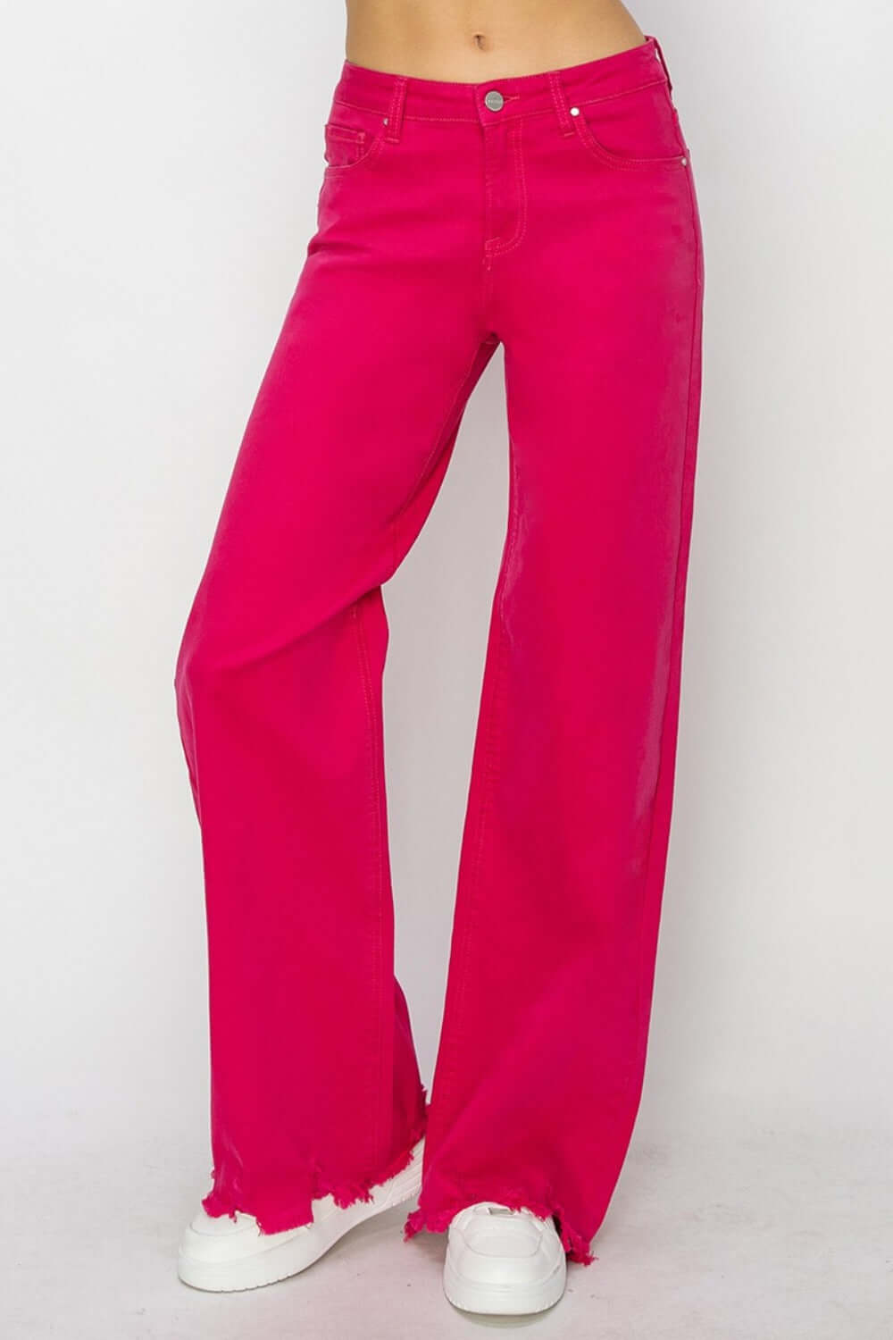 Bright pink high rise wide leg jeans by Risen Jeans, perfect for a trendy retro-inspired look and a flattering fit.