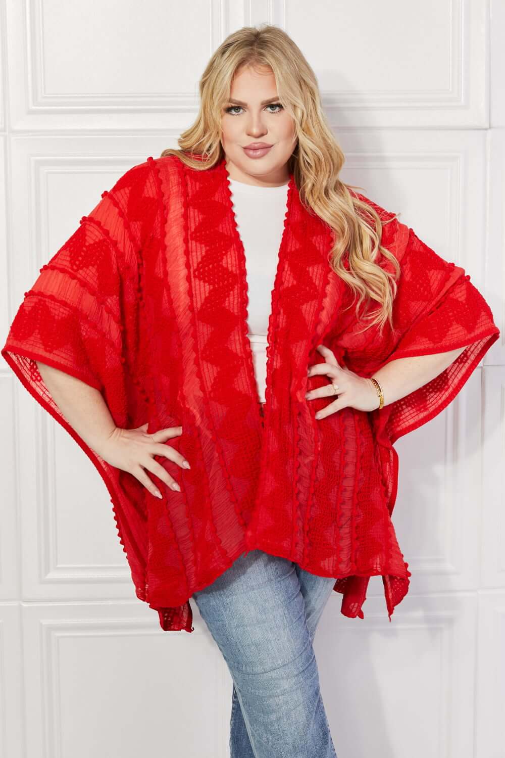 JUSTIN TAYLOR Pom-Pom Asymmetrical Poncho Cardigan in Red at Bella Road