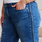 Close-up of Judy Blue braid side detail wide leg jeans on model