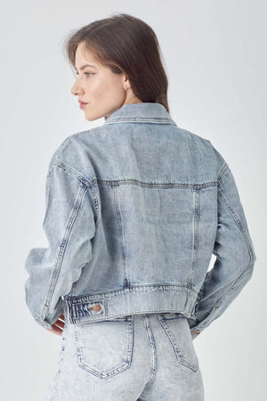 Woman wearing RISEN full size button down cropped denim jacket rear view showing stylish and versatile outerwear piece