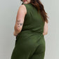 Woman wearing Forever Yours V-Neck Sleeveless Romper in Army Green, showcasing the back design and comfortable fit.