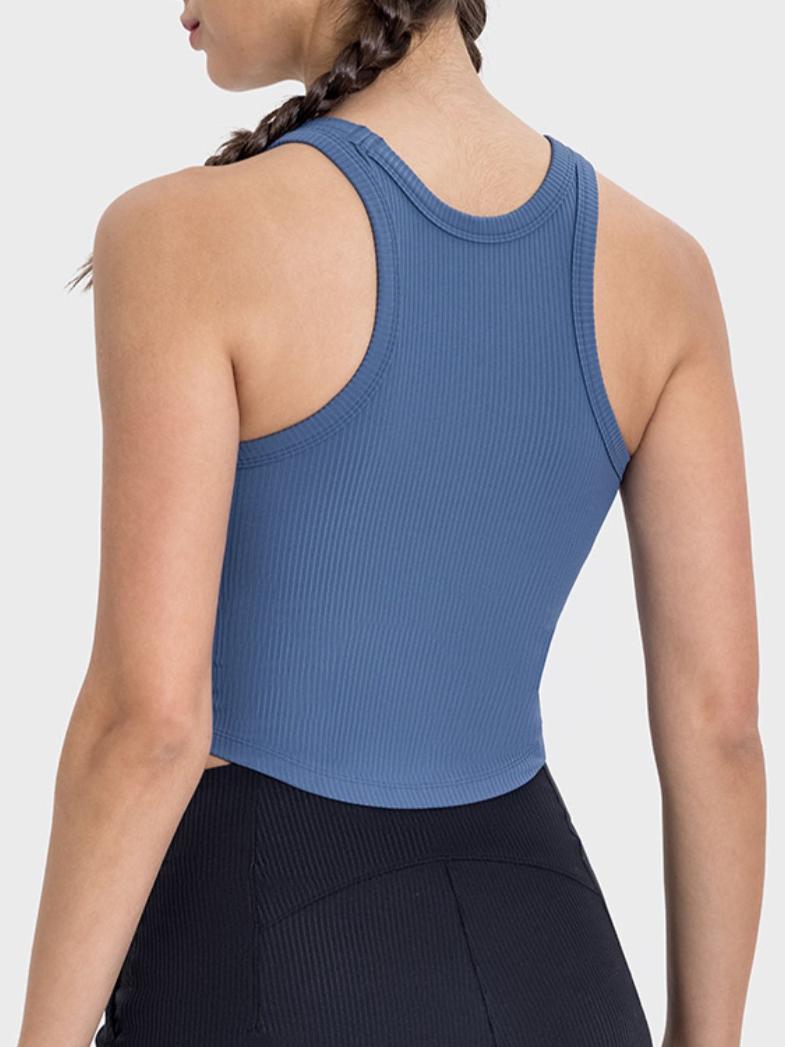 Back view of Millennia Round Neck Racerback Active Tank in blue, showcasing its ribbed texture and crop style.