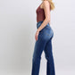 Judy Blue washed straight leg jeans with pockets showcased on a model, offering a flattering silhouette and casual style.