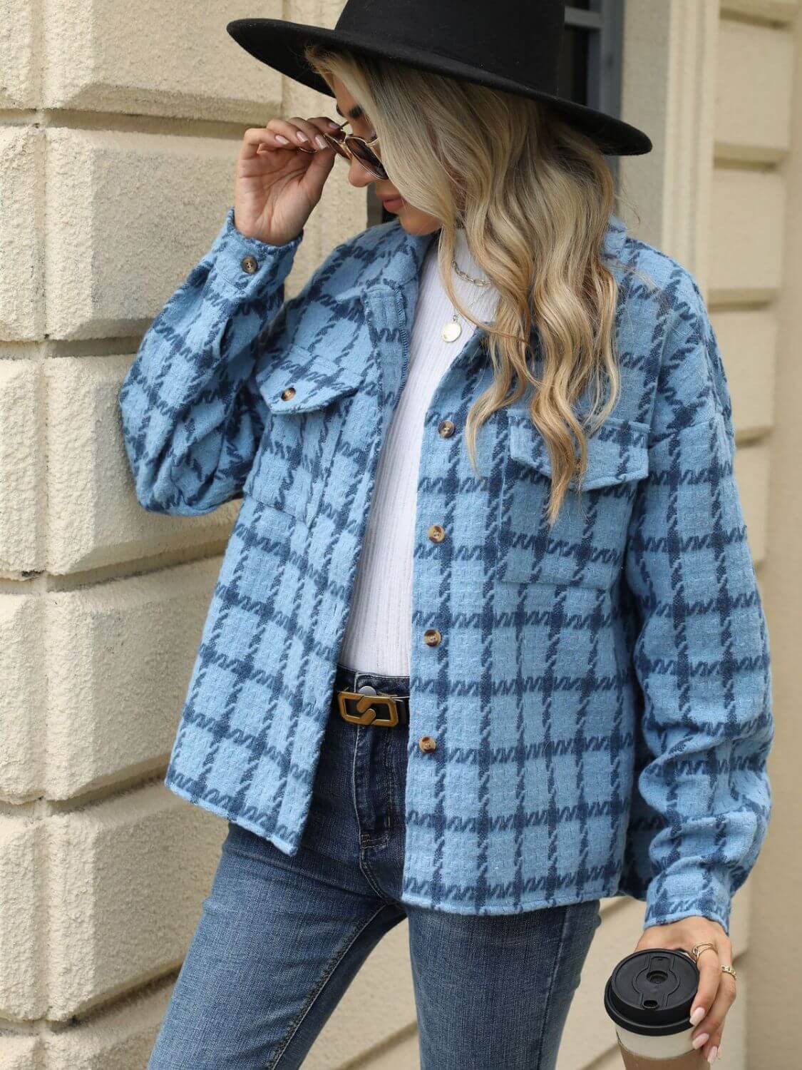 Woman wearing Bella Road Plaid Collared Neck Long Sleeve Jacket with jeans and black hat holding a coffee cup