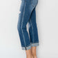 Stylish cuffed ankle distressed straight jeans with a relaxed fit, perfect for casual wear and trendy outfit pairings.