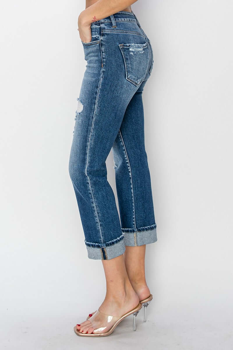 Stylish cuffed ankle distressed straight jeans with a relaxed fit, perfect for casual wear and trendy outfit pairings.