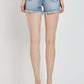 High rise distressed denim shorts by Risen Jeans, perfect for summer with a flattering fit and casual, edgy vibe.