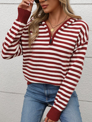 Woman wearing a Perfee burgundy striped long sleeve hooded sweater, adding cozy style to her casual outfit.