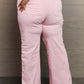 Light pink Raelene High Waist Wide Leg Jeans by Risen Jeans, back view featuring chic retro wide leg design and flattering high-rise waist.