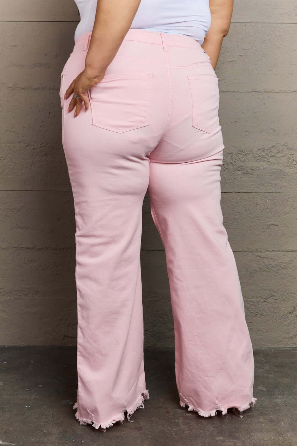 Light pink Raelene High Waist Wide Leg Jeans by Risen Jeans, back view featuring chic retro wide leg design and flattering high-rise waist.