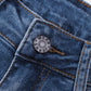 Close-up of button and waistband detail on Bella Road Distressed Straight Jeans with Pockets