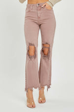 Distressed ankle bootcut Risen Jeans with frayed hems and knee cutouts for a retro flair and contemporary style.