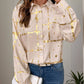 Woman wearing Perfee printed collared neck long sleeve shirt in tan with gold accents, paired with blue jeans.