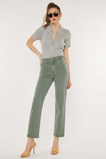 Model wearing Kancan ultra high-rise olive straight jeans with a chic top, showcasing a stylish vintage-inspired outfit.