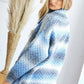 Cozy blue and gray patterned cardigan with a ribbed collar, perfect for stylish layering and winter warmth.