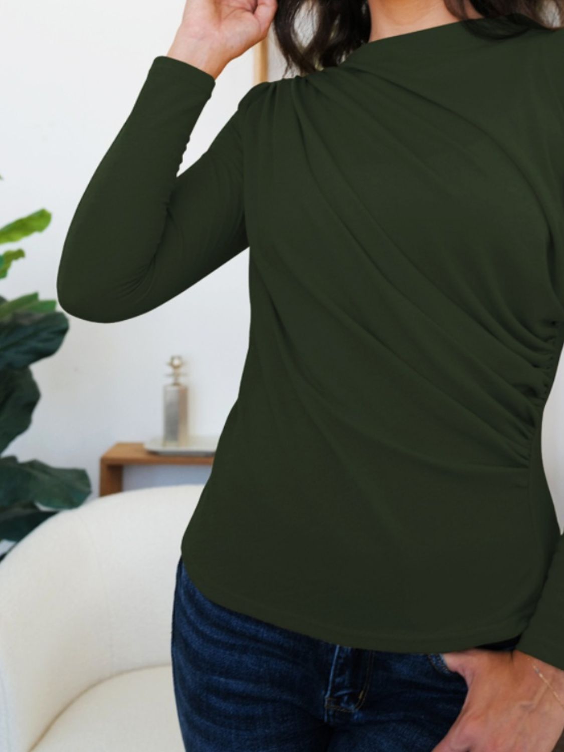 Woman wearing FAM-FAM Army Green Ruched Mock Neck Long Sleeve T-Shirt, perfect for fall fashion and cozy layering.