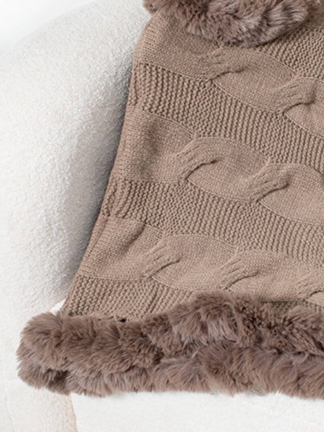 Cozy Bella Road Fuzzy Hem Cable-Knit Poncho in warm taupe, featuring a stylish braided pattern and soft fur hem.