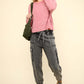 Woman in pink sweater wearing VERY J washed drawstring jogger cargo jeans with pockets and boots, showcasing casual style.