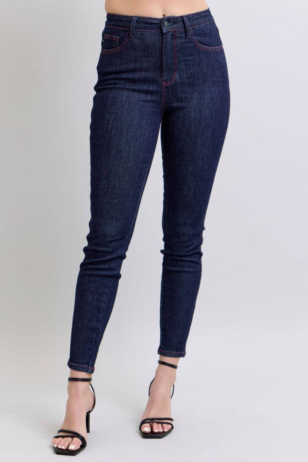 High-rise skinny jeans with heart-shaped back pockets, flattering and playful style for versatile casual or night out looks.