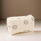 Cute cream corduroy cosmetic pouch with smiley face design, perfect for organizing makeup essentials on-the-go.