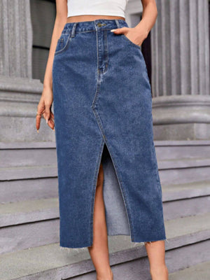 Woman wearing Bella Road Slit Midi Denim Skirt with Pockets, featuring a trendy slit design and casual chic style.