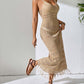 Woman wearing a beige openwork scoop neck cover-up dress with tassels, semi-sheer material, and slightly stretchy 100% polyester fabric.