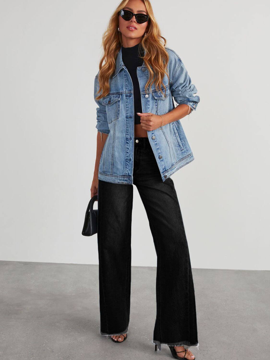 Woman wearing Bella Road Raw Hem Wide Leg Jeans with Pockets, paired with a denim jacket and sunglasses.