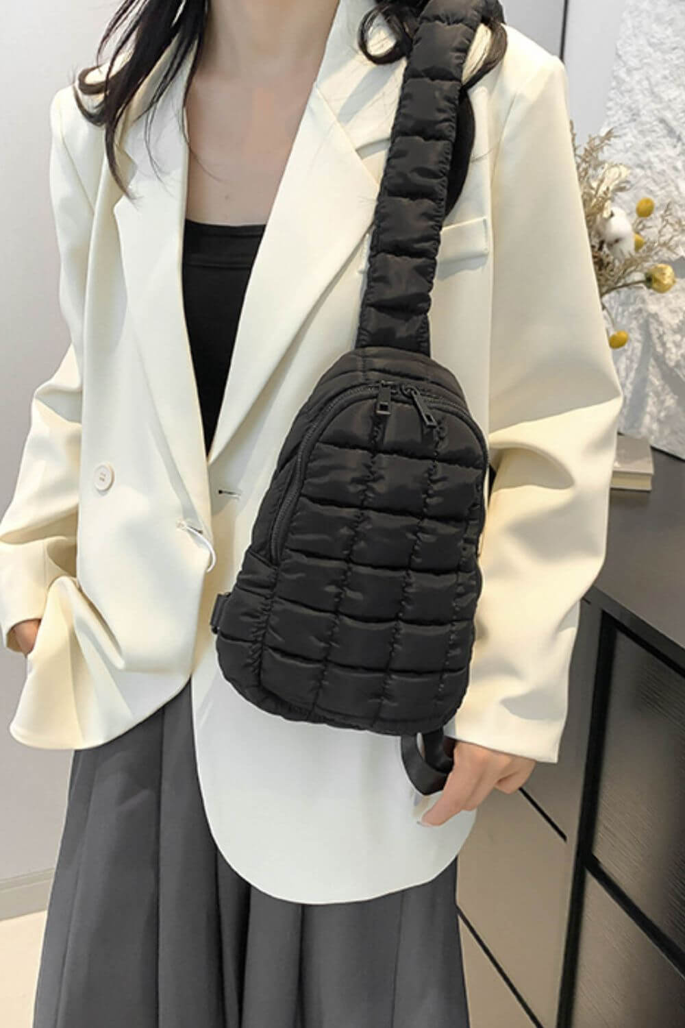 Stylish black quilted nylon crossbody bag from Bella Road, perfect for adding a trendy touch to any outfit.