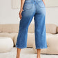 Woman wearing Judy Blue braid side detail wide leg jeans, back view showing unique braid detailing and fashionable design.