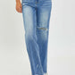 Stylish High Rise Frayed Hem Wide Leg Risen Jeans in blue denim, perfect for a chic and vintage inspired outfit.