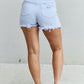 Trendy Katie High Waisted Distressed Shorts in Ice Blue by Risen Jeans, offering comfort and durability for all summer adventures.