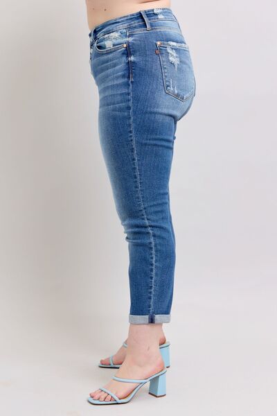 Judy Blue plus size button fly distressed jeans, showcasing stylish pockets and a flattering fit, perfect for casual wear.