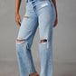 Woman wearing Bella Road distressed straight leg jeans with pockets, featuring ripped details on blue denim, no stretch, casual fit.