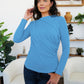 Woman wearing FAM-FAM French Blue ruched mock neck long sleeve t-shirt, perfect stylish fall outfit for layering.