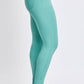 Woman wearing teal Hyperstretch Mid-Rise Skinny Pants by YMI Jeans, showcasing the flexible and comfortable fit in a side profile view.