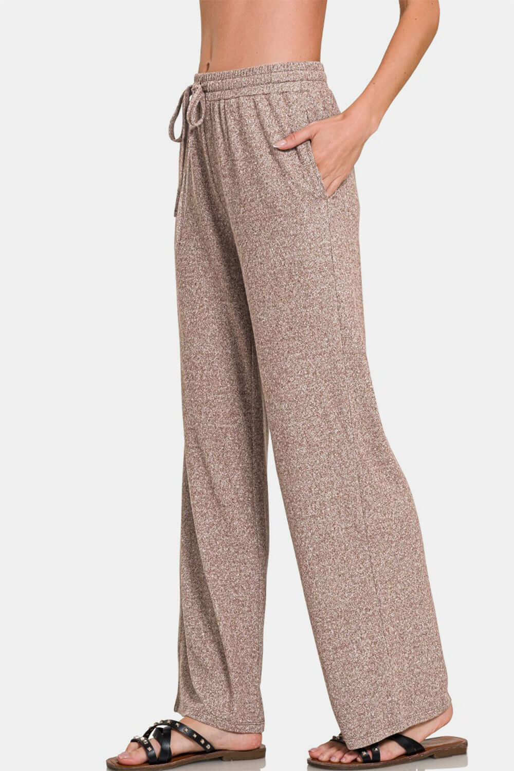 Zenana drawstring wide leg pants with side pockets in beige, offering a chic and comfy look for lounging or casual wear.