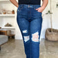 Woman wearing Judy Blue High Waist Rigid Magic Heavy Destroy Straight Jeans showing front distressed design and straight-leg cut