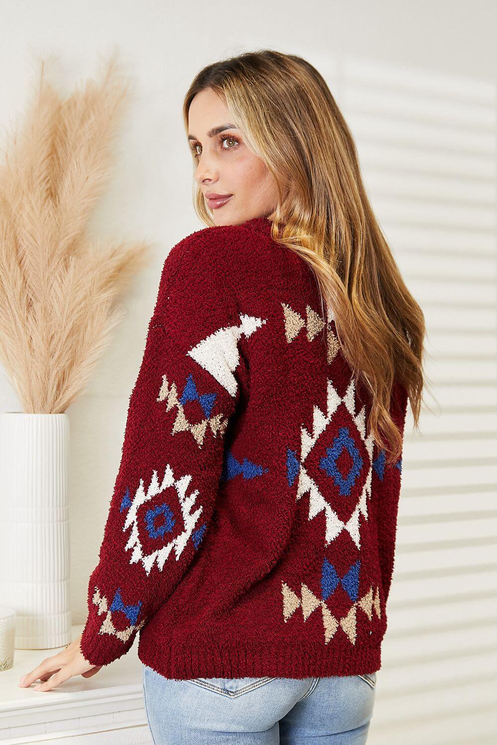 Woman wearing HEYSON Full Size Aztec Soft Fuzzy Sweater, showcasing vibrant Aztec pattern and cozy fuzzy texture.