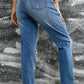 Back view of Bella Road Distressed Sequin Pumpkin Jeans showing unique distressed design and slightly stretchy fit