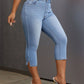 Bella Road Side Slit Skinny Jeans in light blue, featuring stylish slits and functional pockets, paired with trendy heels.