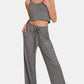 Woman wearing Zenana drawstring wide leg pants with side pockets, perfect for a comfy and chic look.