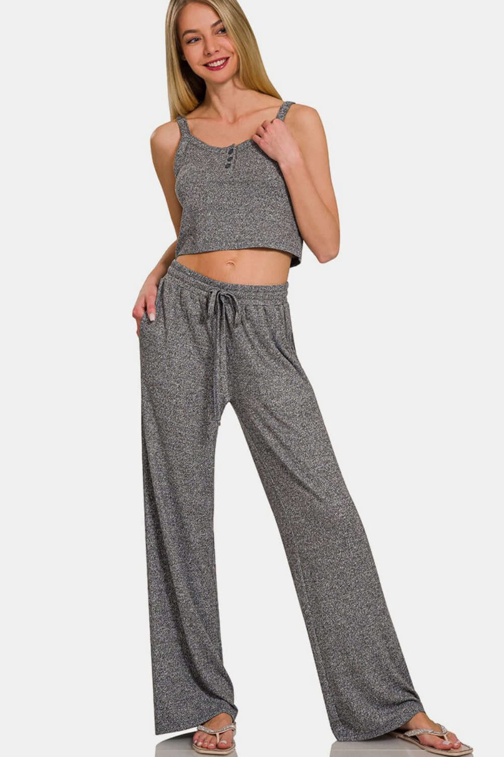 Woman wearing Zenana drawstring wide leg pants with side pockets, perfect for a comfy and chic look.