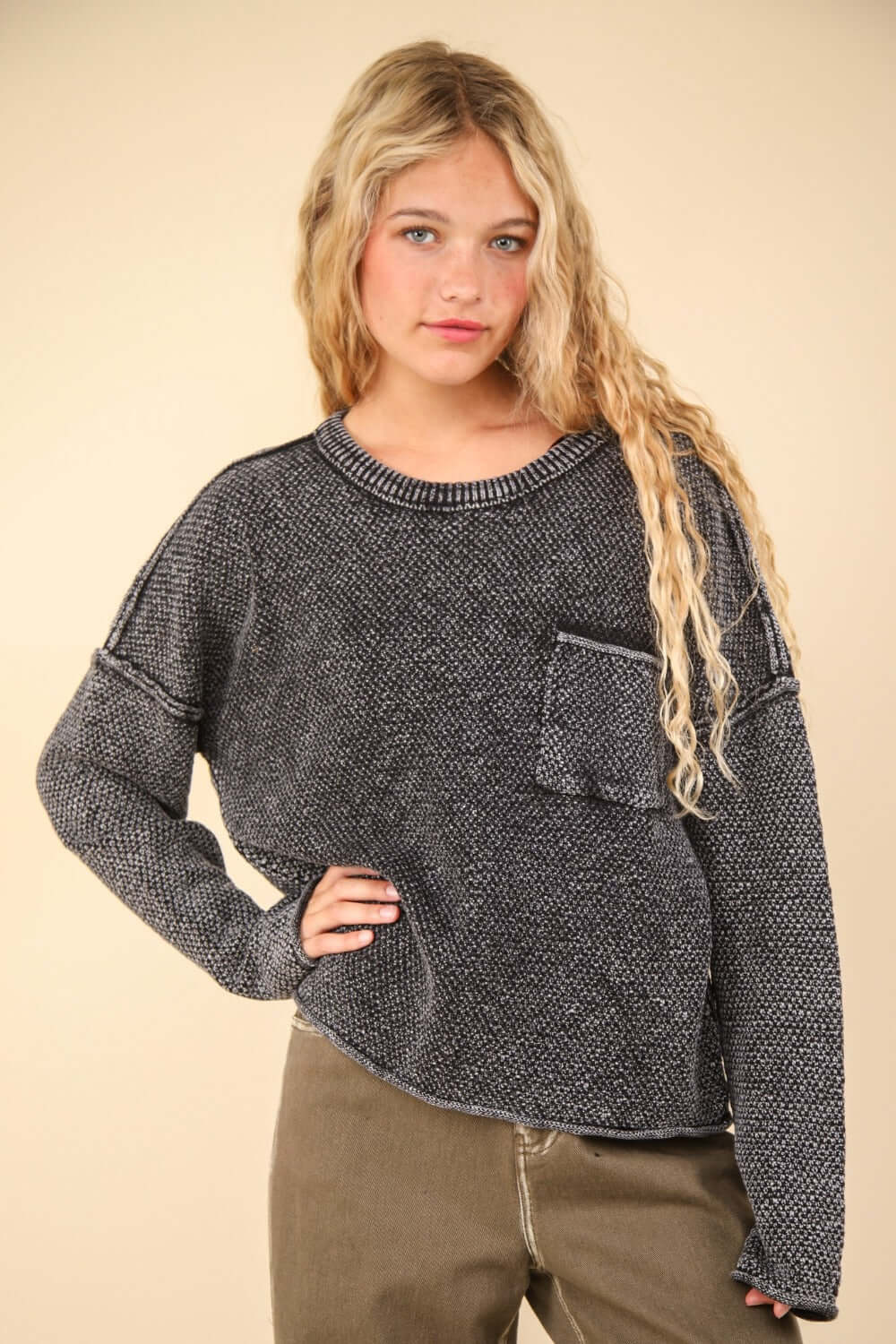 Woman wearing Very J Mineral Washed Exposed Seam Sweater with drop shoulder, round neck, long sleeves, patch pocket, and rolled hem.