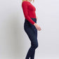 Woman wearing Judy Blue heart-shaped back pockets skinny jeans with a red top and heels.