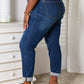 Woman wearing Skinny Cropped Judy Blue Jeans with heels, side view showing back pockets and rolled cuffs