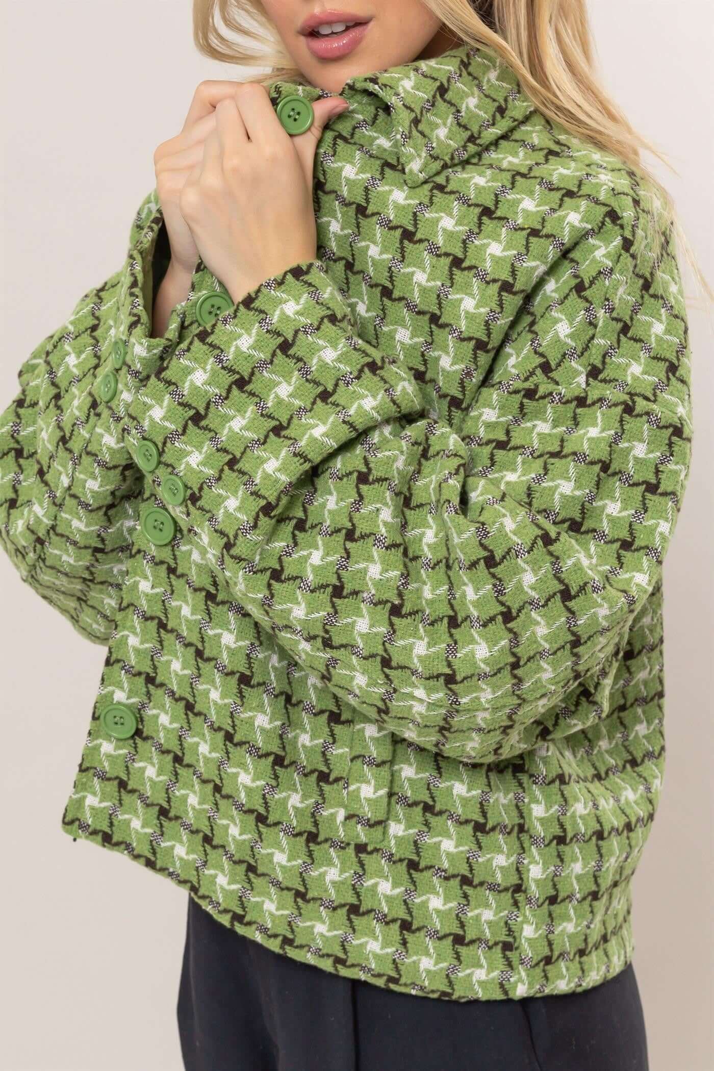 Stylish green plaid button-up jacket featuring a collared neck and cozy design, perfect for layering and trendy looks.