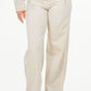 American Bazi high waist distressed wide leg jeans in cream, offering a trendy and comfortable fit.