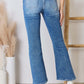 Risen high rise ankle flare jeans in blue, showcasing back view with flattering fit and stylish design.